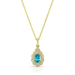 Blue Topaz And Diamond Oval Bezel Pendant With Teardrop Scallop Frame In 14k Yellow Gold (7x5mm) Adj Chain